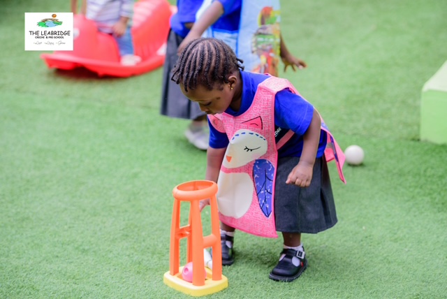 A child playing outdoors at The Leabridge School